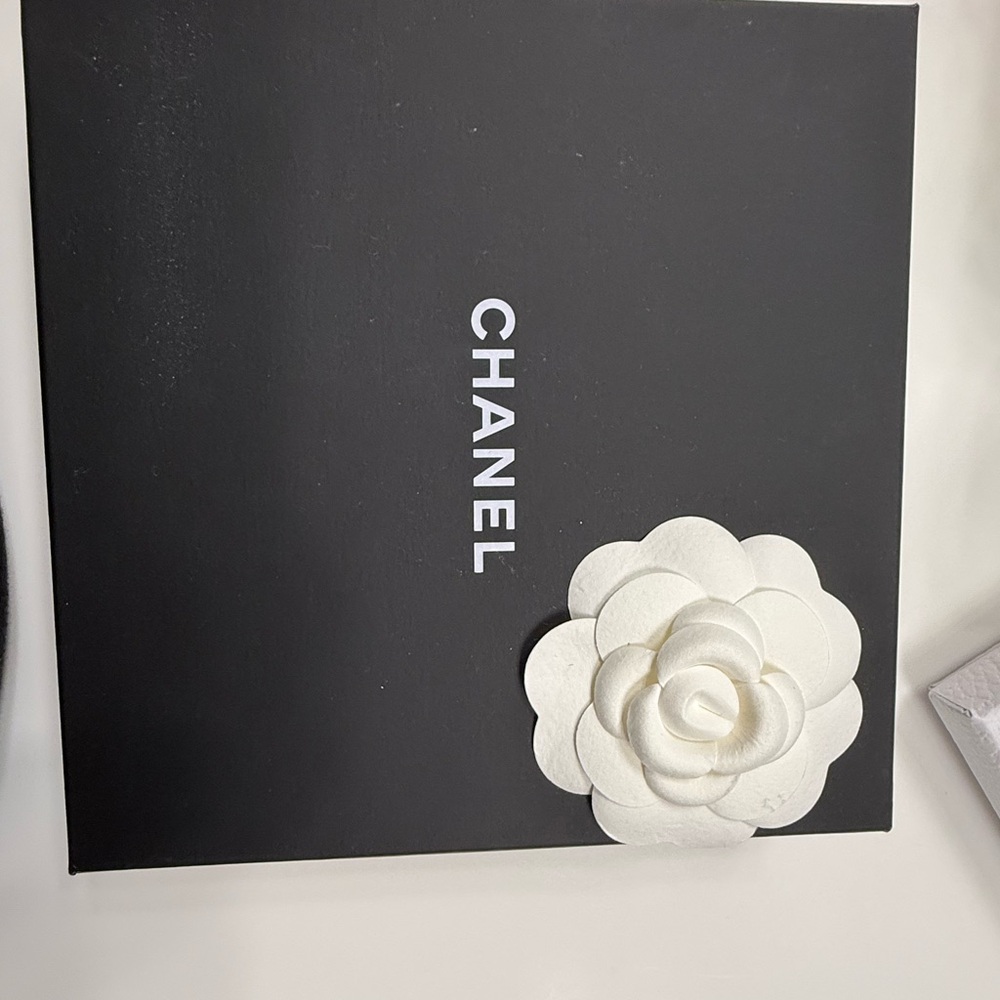 CHANEL Black Box with White Floral Accent